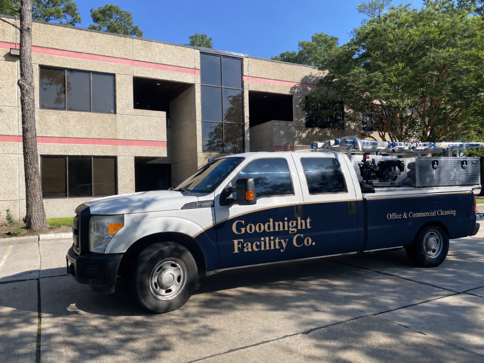 Goodnight Facility Co. service truck outside a client building